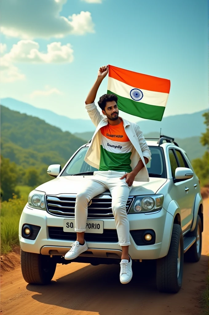 Create an Real image featuring a young man sitting on the hood of scorpio car, with Indian's scenic background. He's holding a flag celebrating Indian 15th August. The boy wears a tirnga T-shirt with 'soumyadip' printed on it, white jacket, white pants, white shoes
