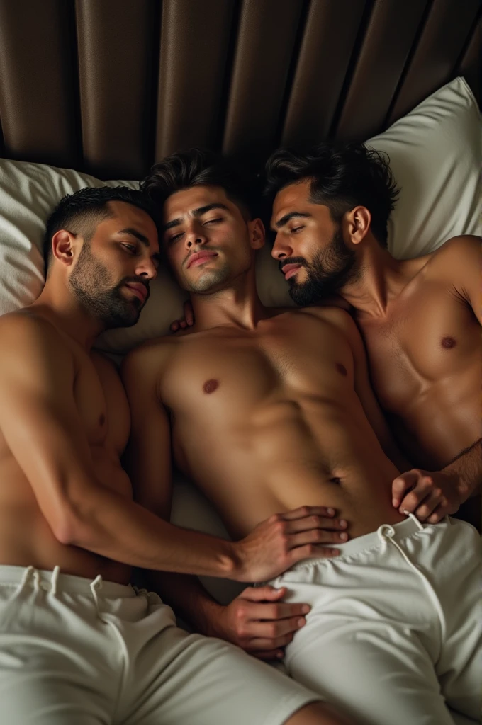 There are 3 Latino men laying in bed together with boxers on uncensored porn