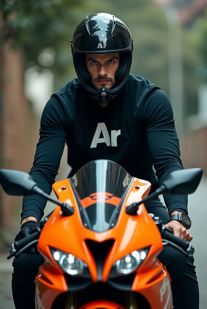 A man in a black shirt with the words Ar written on it.Mubarack wearing a black helmet and standing on an orange Repsol CBR motorbike,on the hood of the motorbike there is a word written psychopath