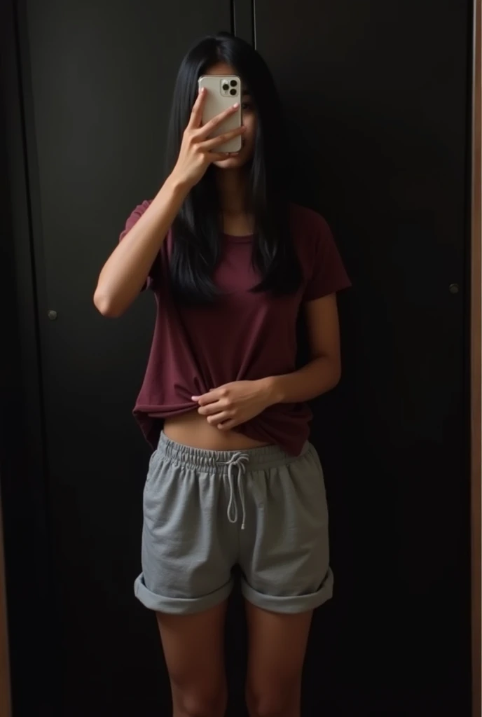 (photorealism:1.2), indian girl, brown body, long black straight hair, perky breasts, body, taking mirror selfie, sides of mirror not visible, iphone 15, phone covers face, face hidden, phone vertical, front facing, standing, standing confidently, full body from head to toes, room, black wardrobe without any design in the background, wardrobe door closed, wardrobe kept parallel to mirror, sides of wardrobe not visible, dark room, spotlight from top, grey loose cotton shorts, maroon tshirt, right hand holding phone covering face, left hand pulling tshirt up showing white bra