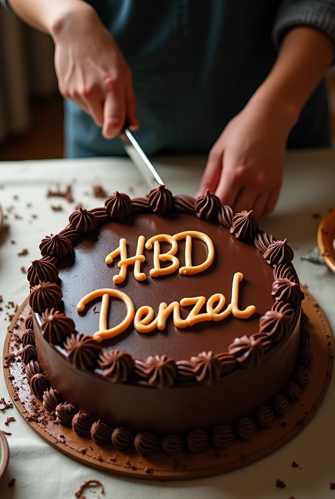 Generate a pic of birthday cake on table with chocolate cover. The name on cake should be HBD denzel. Boy cutting it just one hand of boy should came in pic that too with knife while cutting cake. The image should look like taken from top real image. Crop the face. And it should look like boy himself is taking pic