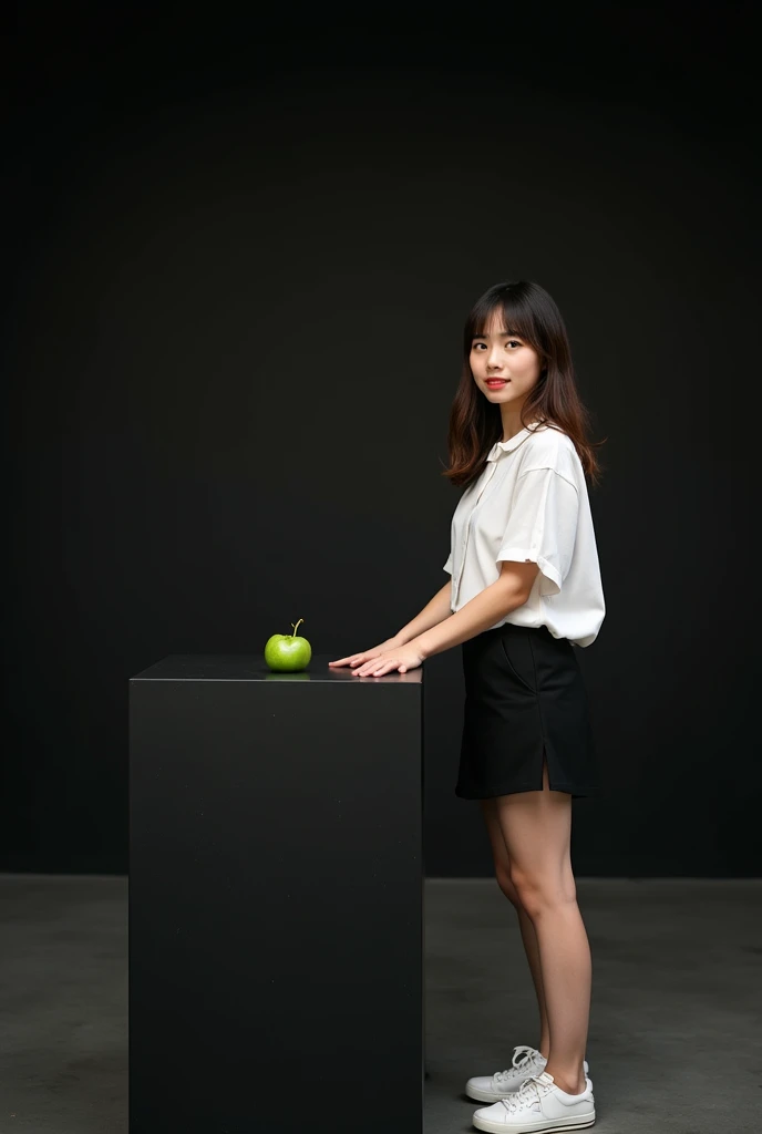 main item is a high ,black ,huge surface ,table displaying a very small green cude(size like a fist) with no shadow ,
and a 16years old ,,CUTE, BEAUTIFUL ,asian, with Bangs,white shirt,black short skirt, super huge boobs(34 E CUP) ,very white skin tone ager standing next to it
and the whole body facing the camera
the back ground is a black wall
taking a realistic far view photo