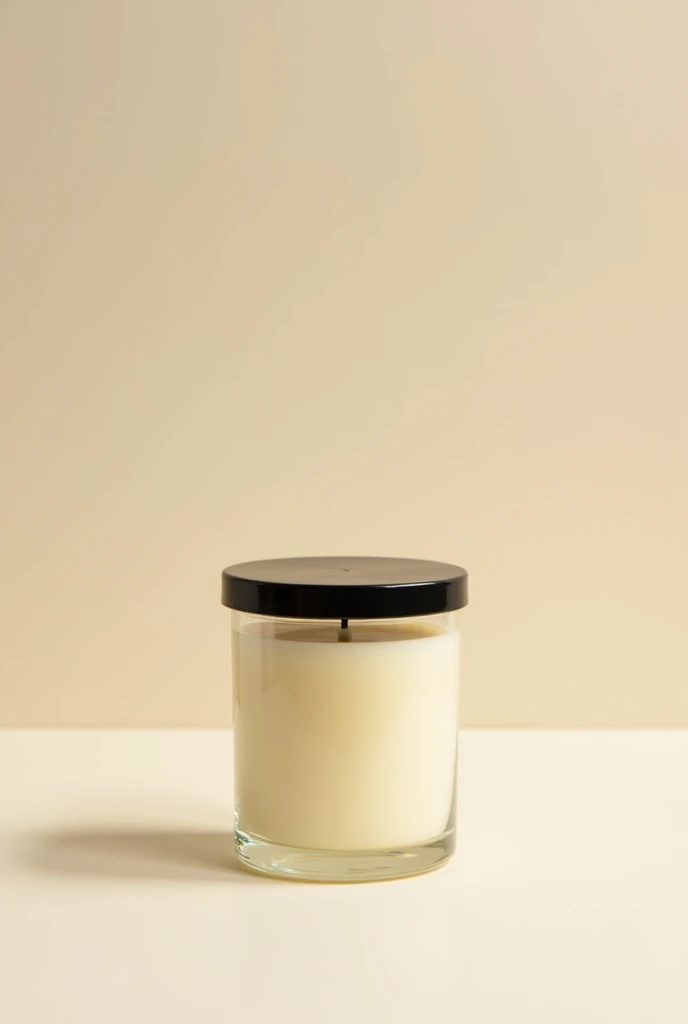 Good quality photo of vanilla scented candle in a glass jar with black lid
