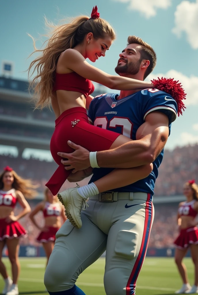 Beautiful cheerleader in red being cradle carried by a muscular handsome football quarterback. Football player in blue uniform carrying woman. Woman completely off the ground. Cheerleaders in background.
