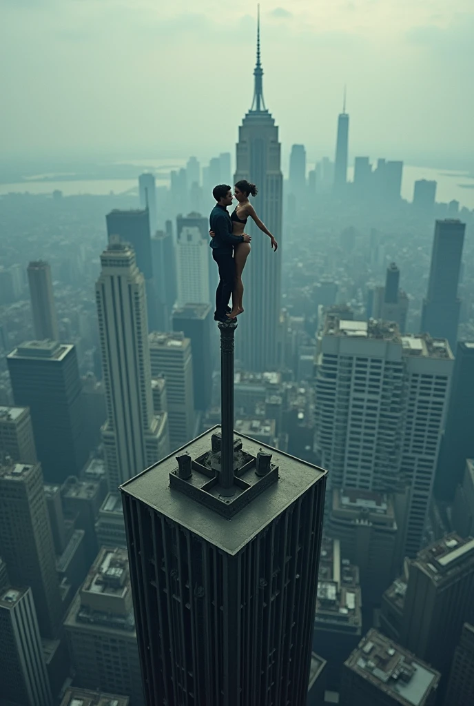 Drone shot of a couple of a man and a woman, doing an artistic gymnastics pose on the tower of a building. They are seen balancing on the terrace