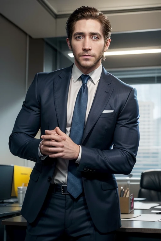 Jake gyllenhaal with short dark brown hair slicked back, wearing a blue suit with a yellow tie in an office.