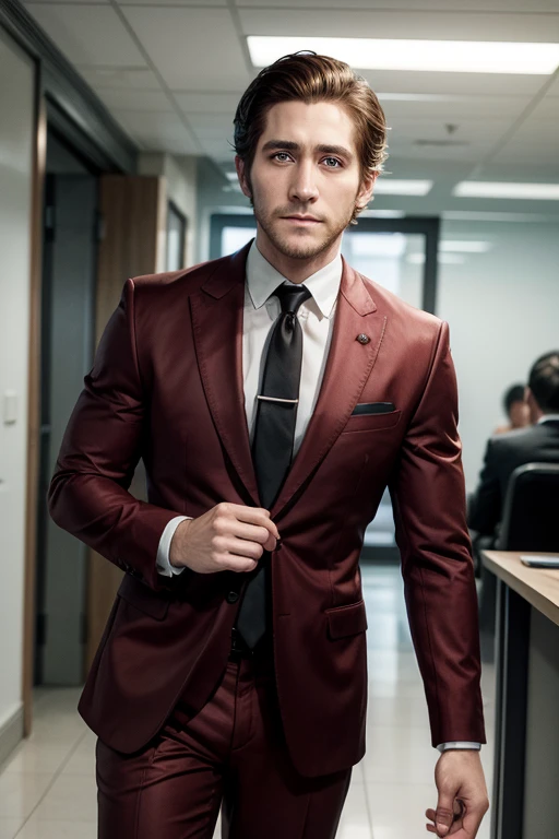 Jake gyllenhaal with short dark brown hair slicked back, wearing a red suit with a black tie in an office.