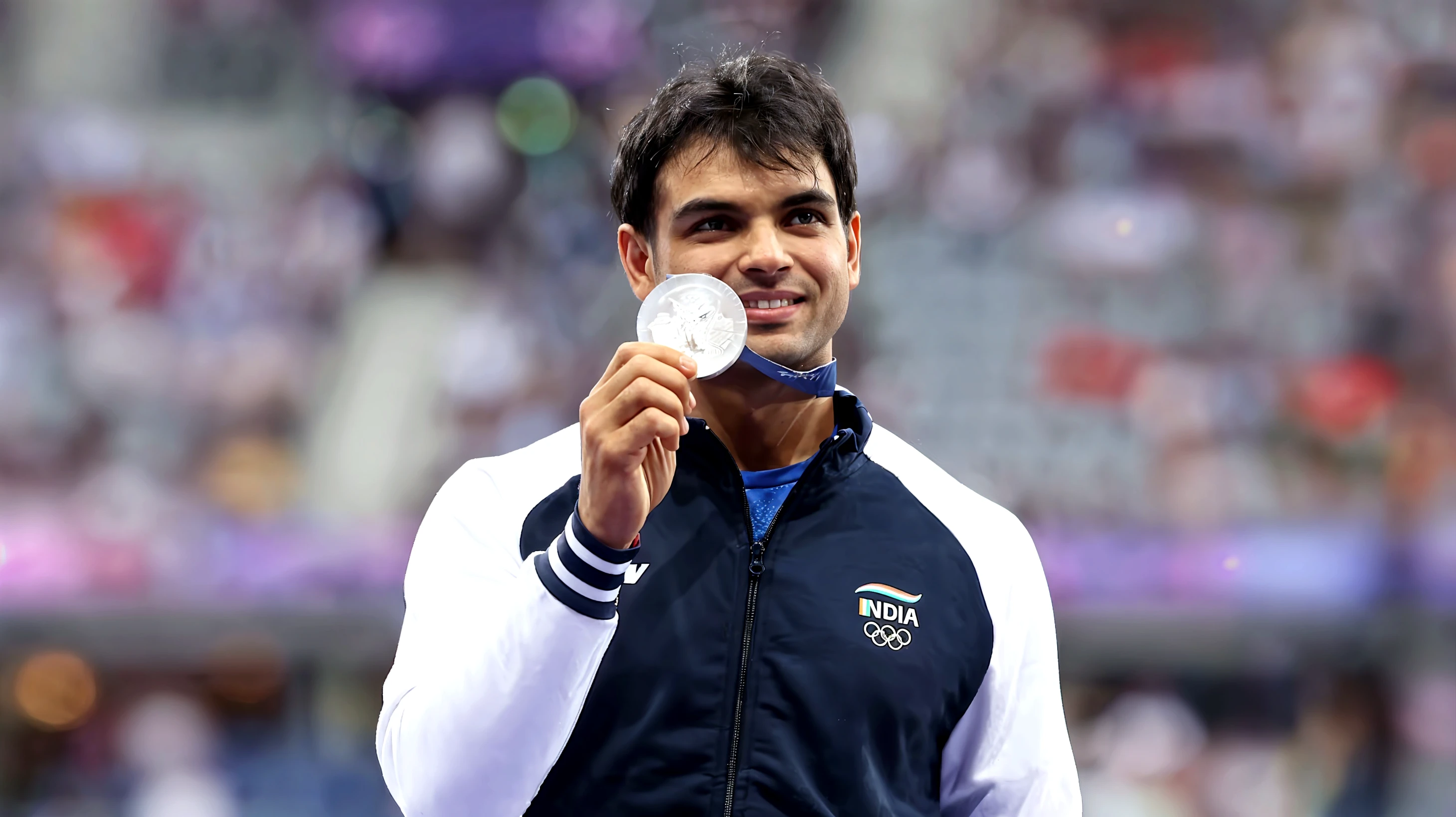 Base model of a handsome indian man, in the Olympic stadium, homoerotic, masterpiece, , handsome face, posing for photo shoot, ultra HD, 16k resolution, handsome face, beautiful eyes, messy hair, he is an Olympic swimmer, (wearing indian Olympic team Jersey), crotch bulge, Olympic games 