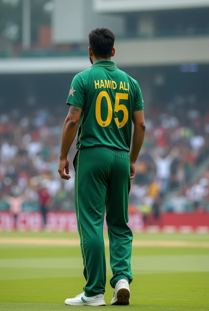 Muhammad Amir bowler standing in cricket stadium wearing a Pakistan Cricket Team shirt with Hamid Ali 05 written on the back of shirt.