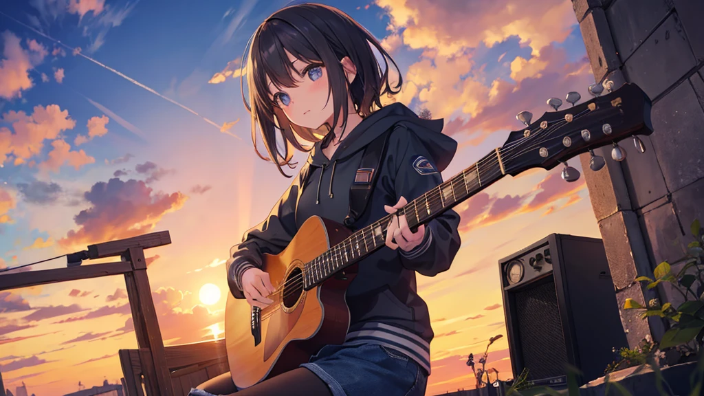 A girl playing guitar at dusk.