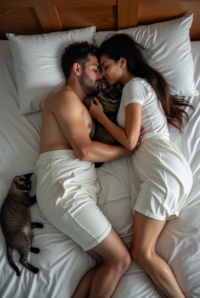 Couple sleeping in a double bed, tall, white, fat man, short, fair-skinned, beautiful black woman with straight hair sleeping with her head in the man's arms, a gray feline sleeping near the man's legs, and a Siamese cat also sleeping in the corner of the bed, from above view.
