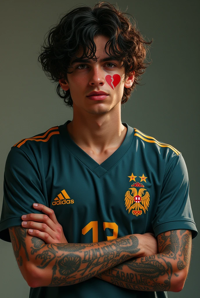 A young man with a tattoo on his arm that reads "between mistakes and successes a single chance" and a broken heart tattoo on his face, wearing a Flamengo shirt. , curly hair