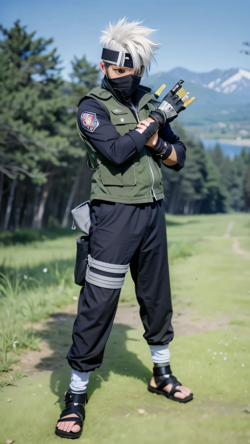 The image shows an anime character, Kakashi. He has spiky gray hair, and is wearing a headband that covers one of his eyes. His other eye is visible, and he has a black mask that covers the lower part of his face.
The character wears a green vest, typical of a military uniform, over a black long-sleeved shirt. He also wears dark blue pants, with white bandages wrapped around one of his legs and arms. Additionally, he has black sandals that leave his toes exposed. He is in a relaxed position, with his arms crossed, and the background shows a wooded area, suggesting he is outdoors.