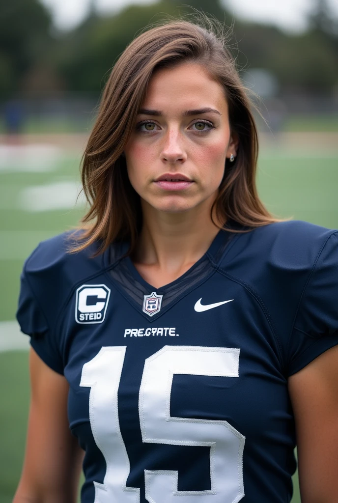 A photo of Emma Fisher, a brunette quarterback for the female Penn State Nittany Lions football team. Number 15.