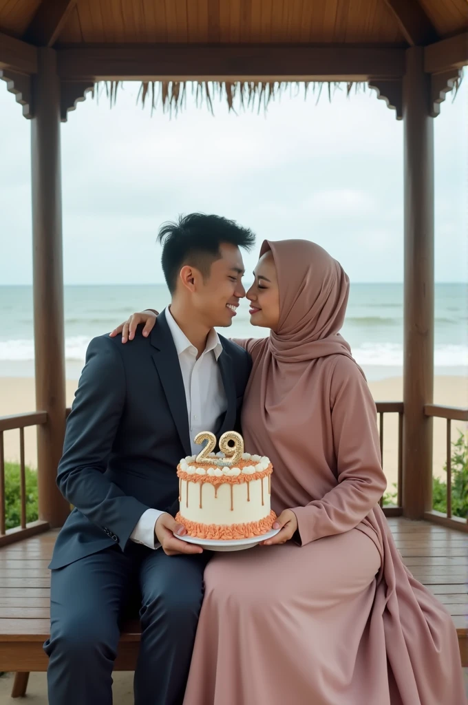 Portrait of young Indonesian man wearing suit and young Indonesian woman wearing luxurious hijab robe,sitting cuddling while holding a birthday cake in a gazebo on the beach, facing the camera,and on the birthday cake there is the number 29.