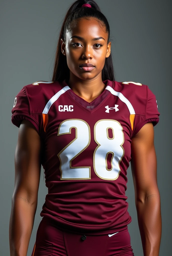 A photo of Jeanette Laurent, a cornerback for the female Virginia Tech Hokies football team. Number 28.