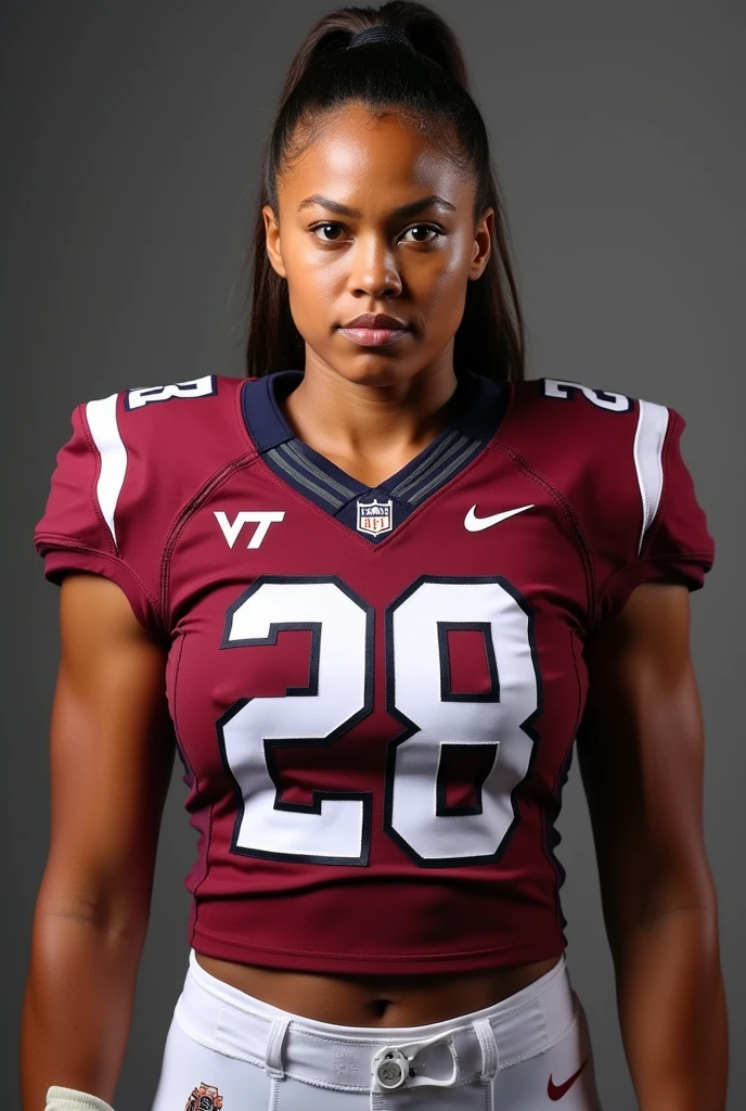 A photo of Jeanette Laurent, a cornerback for the female Virginia Tech Hokies football team. Number 28.