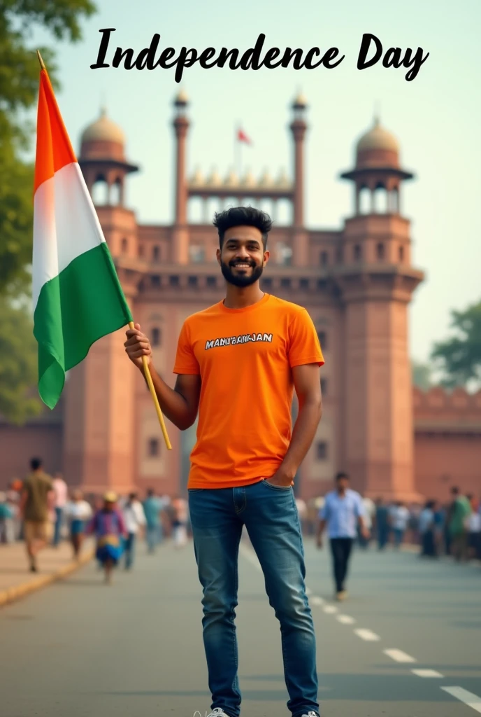  A real 27 years old boy, Wearing Orange T shirt blue jeans sneakers and the name “MANURANJAN” is written on his t-shirt and the boy is standing on the road with holding a national flag of India, and behind him is the Red Fort Delhi. And written on sky “Independence Day” Create Realistic image high quality