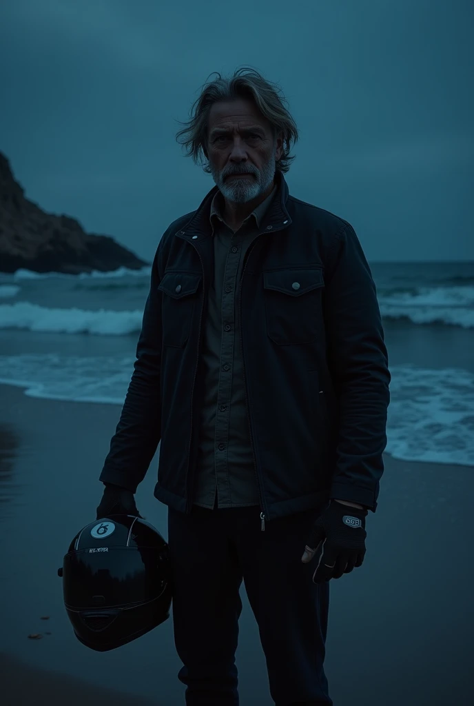 A man with by motor bicycle glove on holding a motorcycle helmet on at night time beach