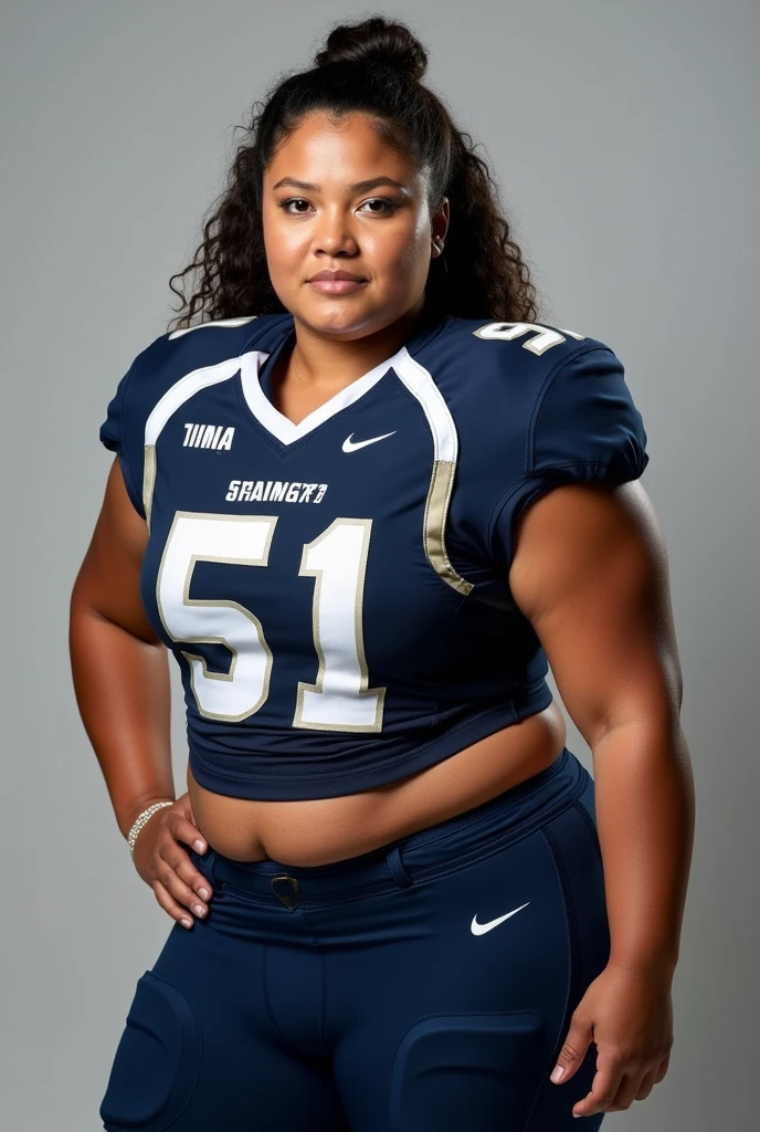 A photo of Tina Nguyen, a Tight End for the female Howard Bison football team. Number 51. Curvy as hell. Uniforms are navy with grey numbers and white trim
