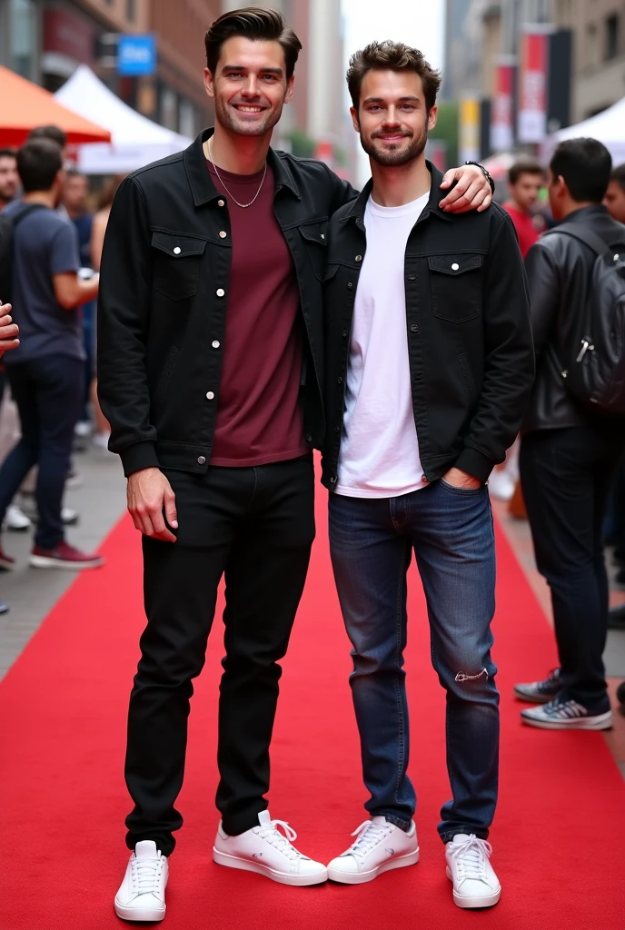 Tyler Hoechlin wears black jeans, a basic burgundy t-shirt, a black jacket and white tennis shoes, She is standing smiling next to an attractive young man with short hair, white skin and brown eyes, He is wearing blue jeans and a white t-shirt. Both are on the red carpet at Comic-Con.