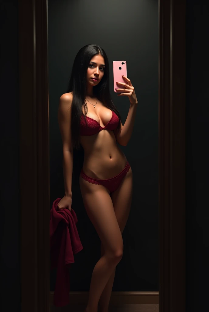 (photorealism:1.2), indian  girl, taking mirror selfie with iphone, iphone pink colour, brown body, long straight hair, plain black wardrobe covers the background, sides of mirror hidden, dark room, mild spotlight from above, front shot, full body shot, standing confidently, full body naked, no clothes, red lacy panties, wide hips, phone hides face, crumbled maroon tshirt on one hand, phone hides eyes, topless, no bra, nipples hidden by long hair