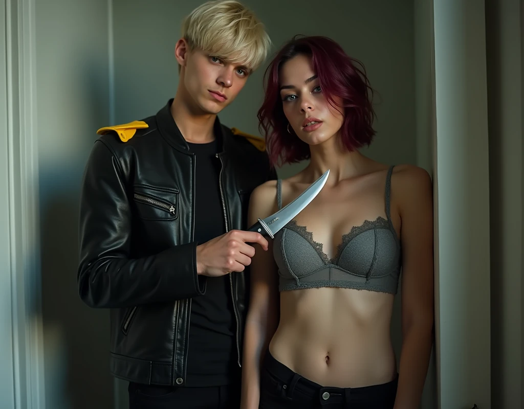 181 cm tall, 22-year-old boyish male, lean figure, short platinum blond layered hair with side swept bangs, blue eyes, Germanic-Icelandic features, tight black pants, black leather jacket with yellow accents on shoulders, closed mouth smile, stands behind holding k-bar knife, the blade along the neck of a 24-year-old woman of almost the same height, has a fearful expression wearing a grey lacy push-up bra and black pants with vibrant maroon side parted wavy hair and light skin, photorealistic, cinematic