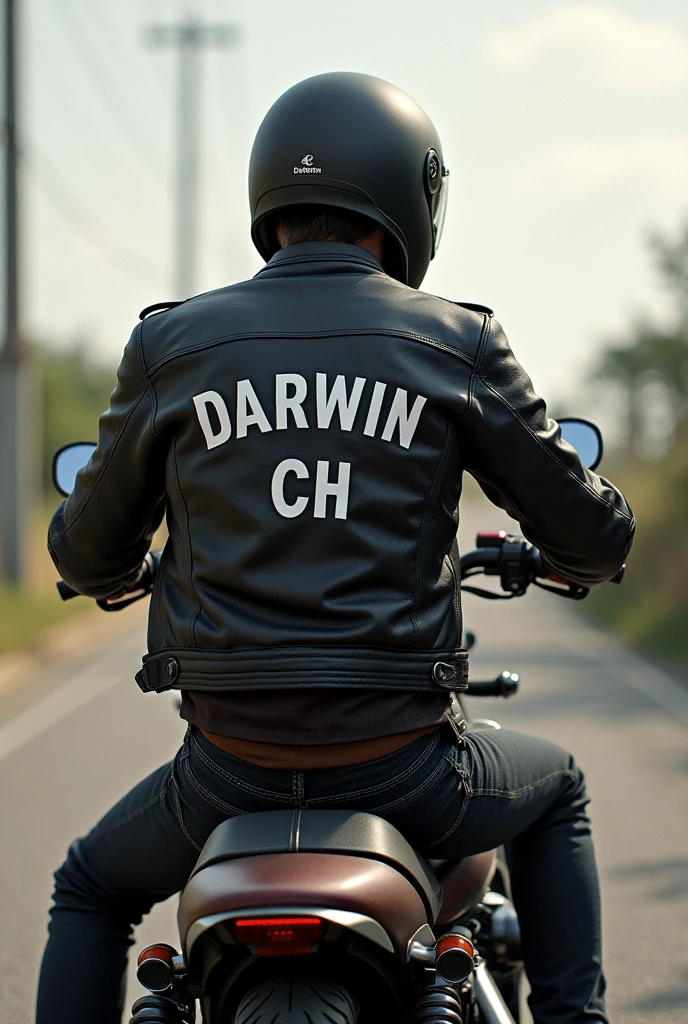 motorcyclist young with helmet on a motorcycle (posing) with a jacket that has his name Darwin Ch on the back