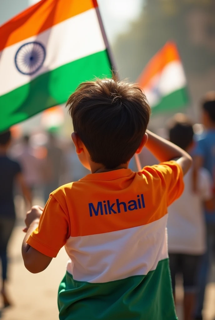 A kid with Mikhail written on back not showing face of his tri colour t shirt holding indian flag
