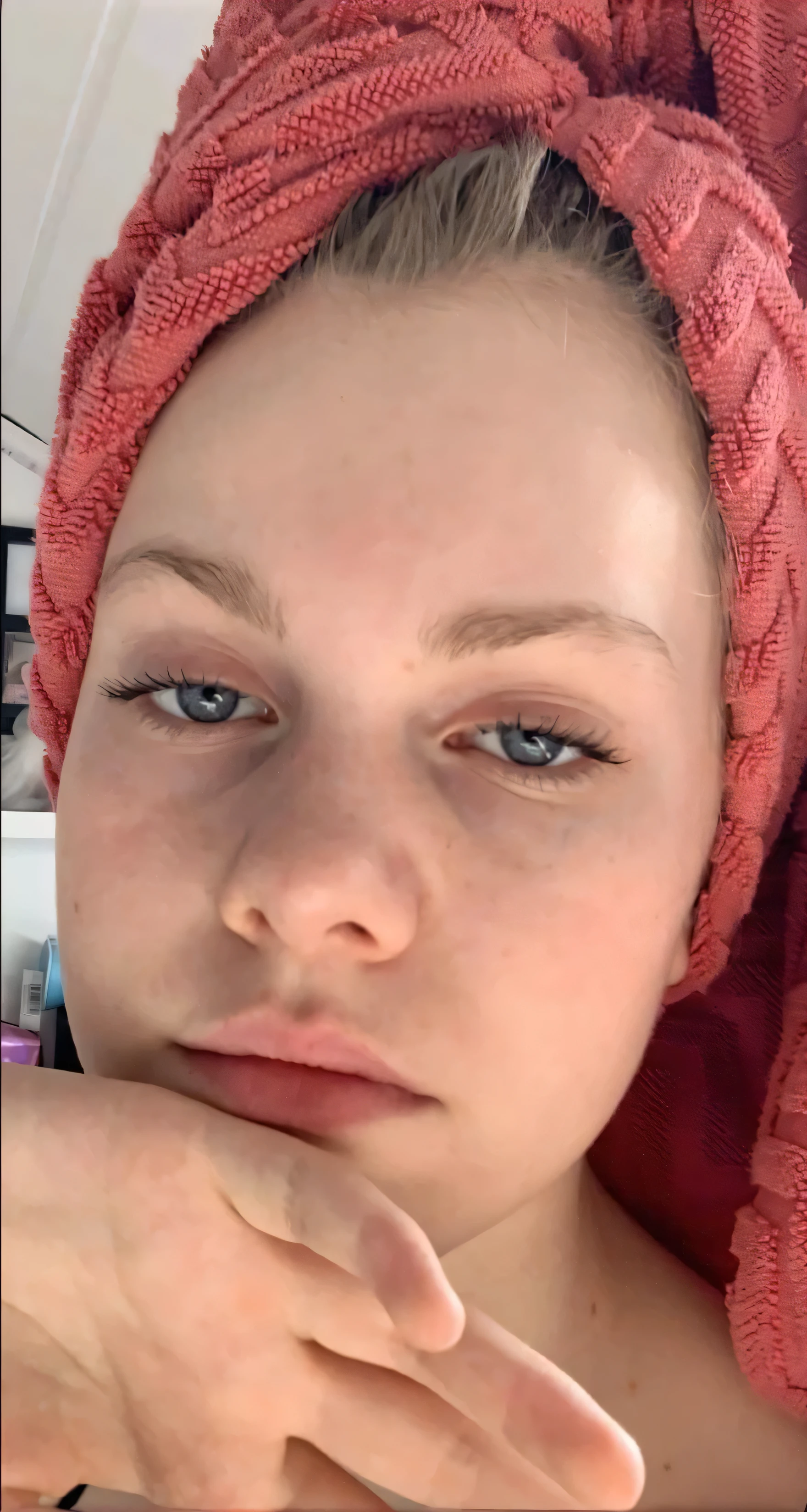 The face in the picture should be the same , all i want i a realistic expand , wearing sexy pyjamas lying on the bed ,with a natural face , looking hot , hair should be blonde , showing off her sexy breasts but not naked just make it hot and sexy 