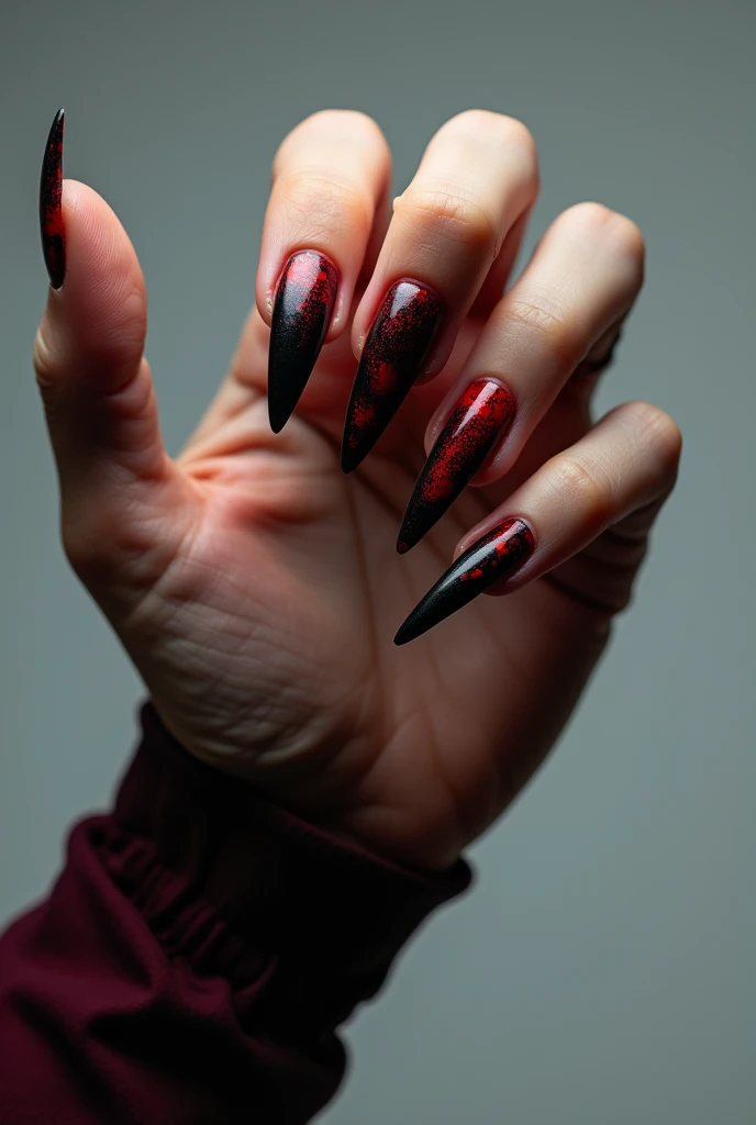 long nails image , painted in black and red with design. that the hand is stretched out as if showing its nails to the camera