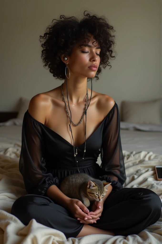 WOMAN SITTING ON THE BED WITH SHORT WAVY HAIR, IN A BLACK SILK DRESS, WITH SEVERAL BLACK STRINGS, HOOP EARRINGS, WITH A CELL PHONE ON SIDE AND A KITTEN LYING ON HER LAP ASLEEP. SHE IS MEDITATING WITH EARPHONES LISTENING TO MUSIC THINKING ABOUT HER GREAT LOVE FROM PAST LIVES, SHE IS PRAYING FOR HER LOVE TO COME BACK HER EX BOYFRIEND MISSES HER