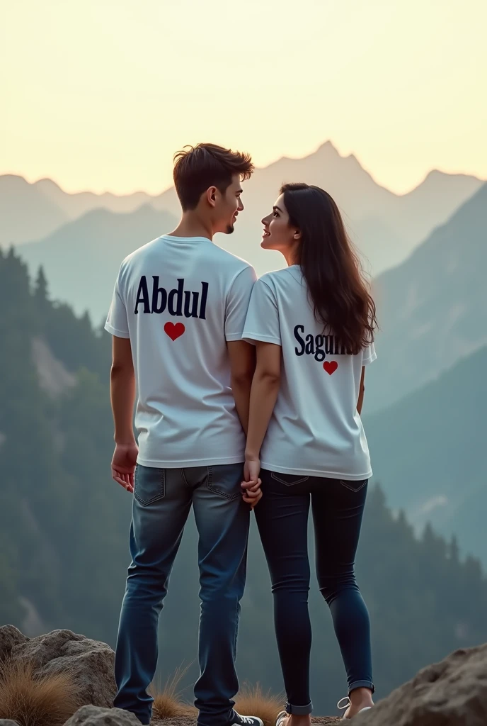 A young couple, enjoying a peaceful moment on a mountain peak, both wearing white T-shirts. The boy's T-shirt has the name 'Abdul' written in deep black letters, positioned above a heart ❤️. Similarly, the girl's T-shirt features the name 'Sagufa
' in dark black letters, also above a heart ❤️."