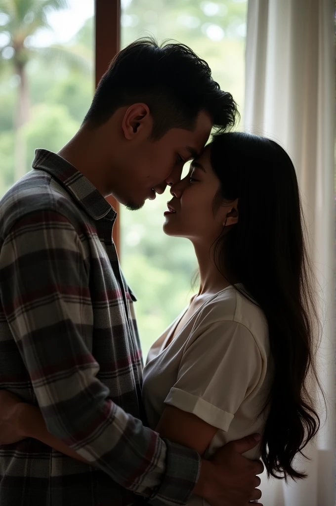 a indonesian man and a indonesian teenage woman girl in a romantic embrace. The man is on the left side of the image, with man's head lower than the girl's head. He has dark hair and is wearing a grey plaid shirt. The girl has long dark hair and is looking down at the man with a gentle expression on her face. The background is blurred, but it appears to be a room with a window and a view of trees outside. The image is taken from a low angle, with the focus on the couple.