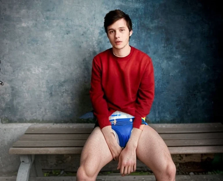 Diaper, tena pattern, Realistic photo of Timothée chalamet, young man, male, very skinny, bare legs, sitting on a bench, wearing a diaper