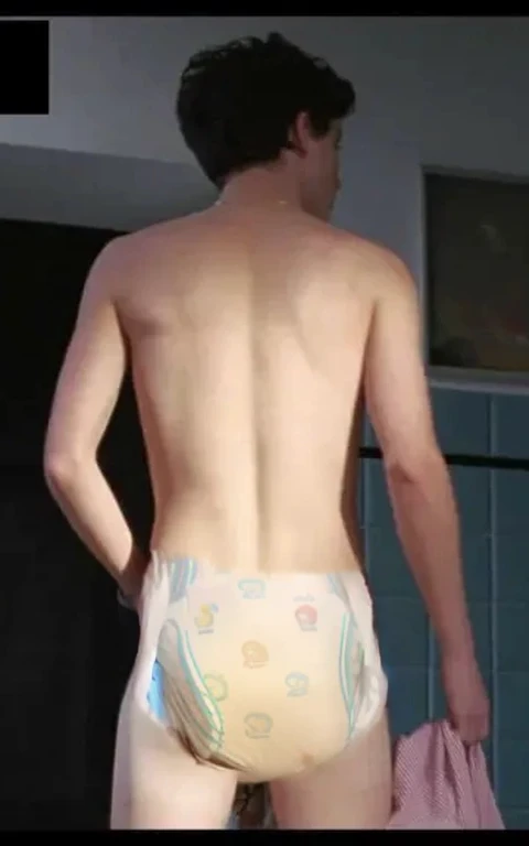 Diaper, pampers pattern, diaper mess, Realistic photo of Timothée chalamet, young man, male, very skinny, bare legs, standing, view from behind, wearing a diaper