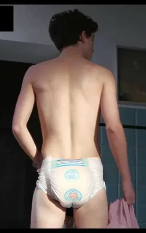 Diaper, pampers pattern, pooped diaper, Realistic photo of Timothée chalamet, young man, male, very skinny, bare legs, standing, view from behind, wearing a diaper, sagging bulging diaper