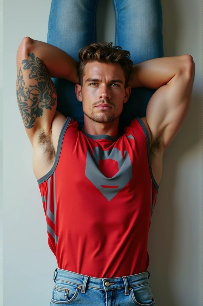 Man with light blue jeans fitted to his body, that is on its back, that he be white-skinned, tanned, Muscular 20-year-old, straight nose, wearing a red sports shirt with gray designs and having a full arm tattoo