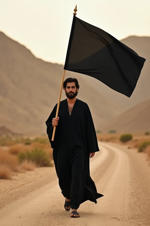 Create a realistic portrait photo for me, with a warm cinematic perspective, of a man dressed in a modest black Arabic robe, with black hair and clear features. He is walking on a semi-desert road, looking forward, and carrying a black flag with no writing on it.  