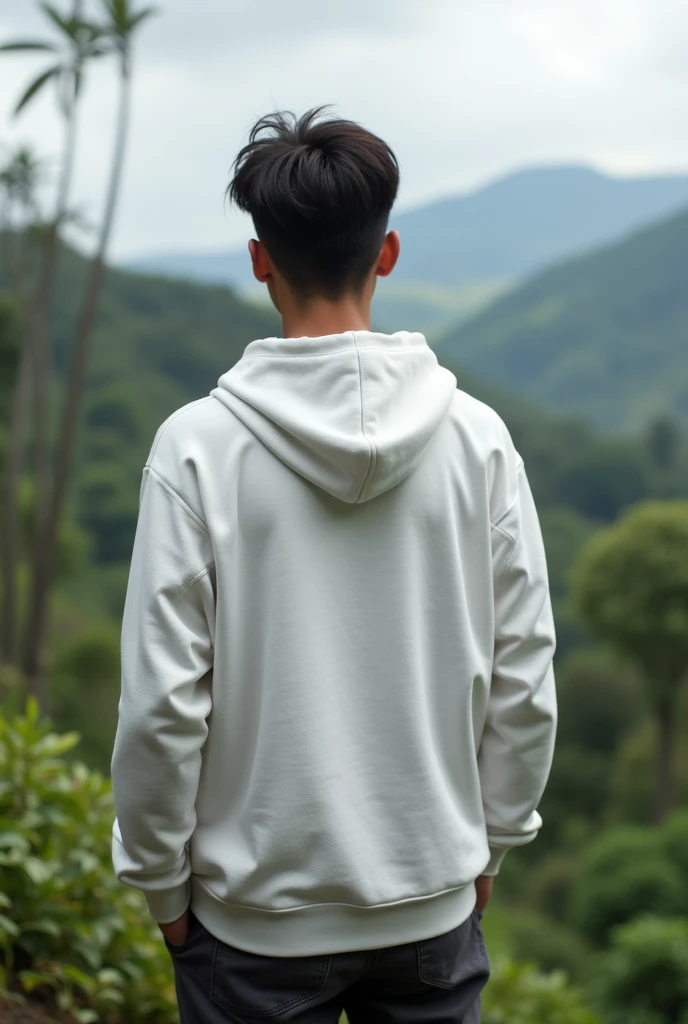 Young man with a white hoodie, back to camera, in Ecuador