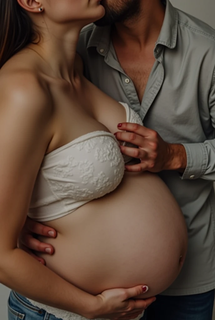 A pregnant woman sucking a man's penis with her mouth