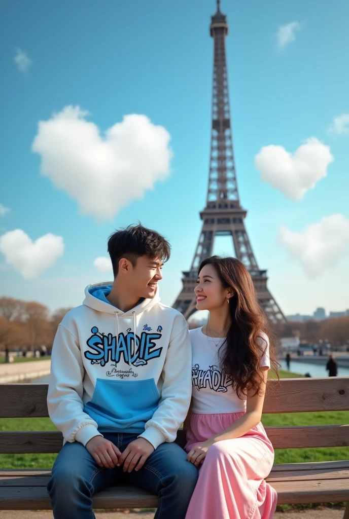 Realistic Visual Photography portrait, Korean face, young husband and wife couple. Handsome 25 year old man wearing a white and blue mixed hoodie with the name "Shadie" with a striking colored graffiti motif. sitting on a wooden bench, in a park. beautiful woman with long flowing hair, wearing a white and pink T-shirt, long flowing skirt. smiling facial expression, the man has a neat and charming undercut hairstyle. He is intimately embraced, with the iconic backdrop of the Eiffel Tower, the afternoon atmosphere with a bright blue sky, clouds forming hearts. Very Beautiful, Realistic, Autofocus Portraits.