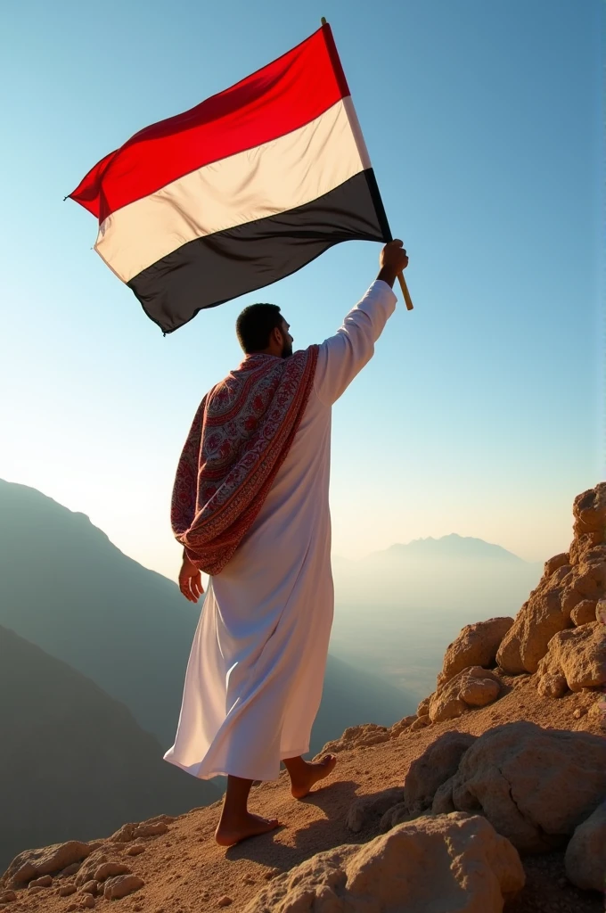 A yemeni man climbing Saber mountain holding the Yemeni flag