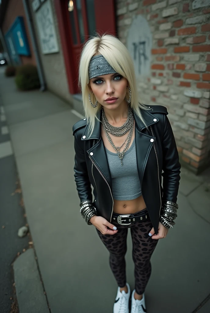 russian milf woman, biker gang member, platinum blonde hair (straight, middle part) with grey bandana headband, with very light blue eyes, extremely pale, heavy eye shadows. Sad face, smeared make up, runny mascara. Wearing black moto jacket, cropped rock band grey t-shirt, leopard print leggings and white tennis sneakers . Lots of metallic bracelets and chain and pearl collars. Tacky leather belt with oversized, excessive silver buckle. Hands in pockets Wide loop earrings.