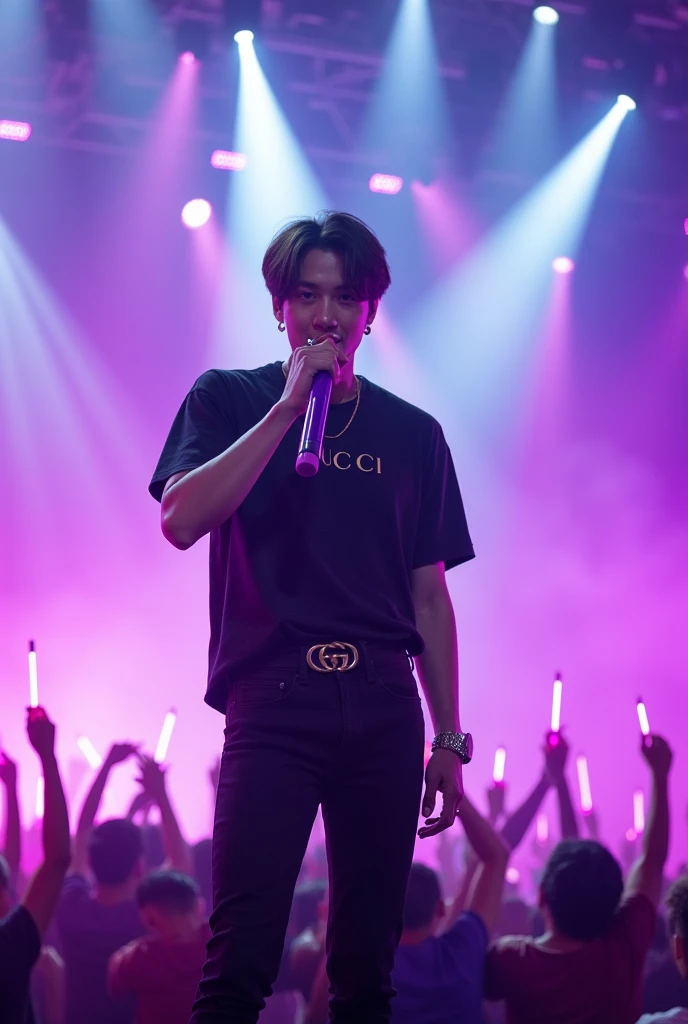 Jungkook from the korean boygroup BTS who sings a song on stage with a purple microphone in his hand, black jeans and a gucci t shirt