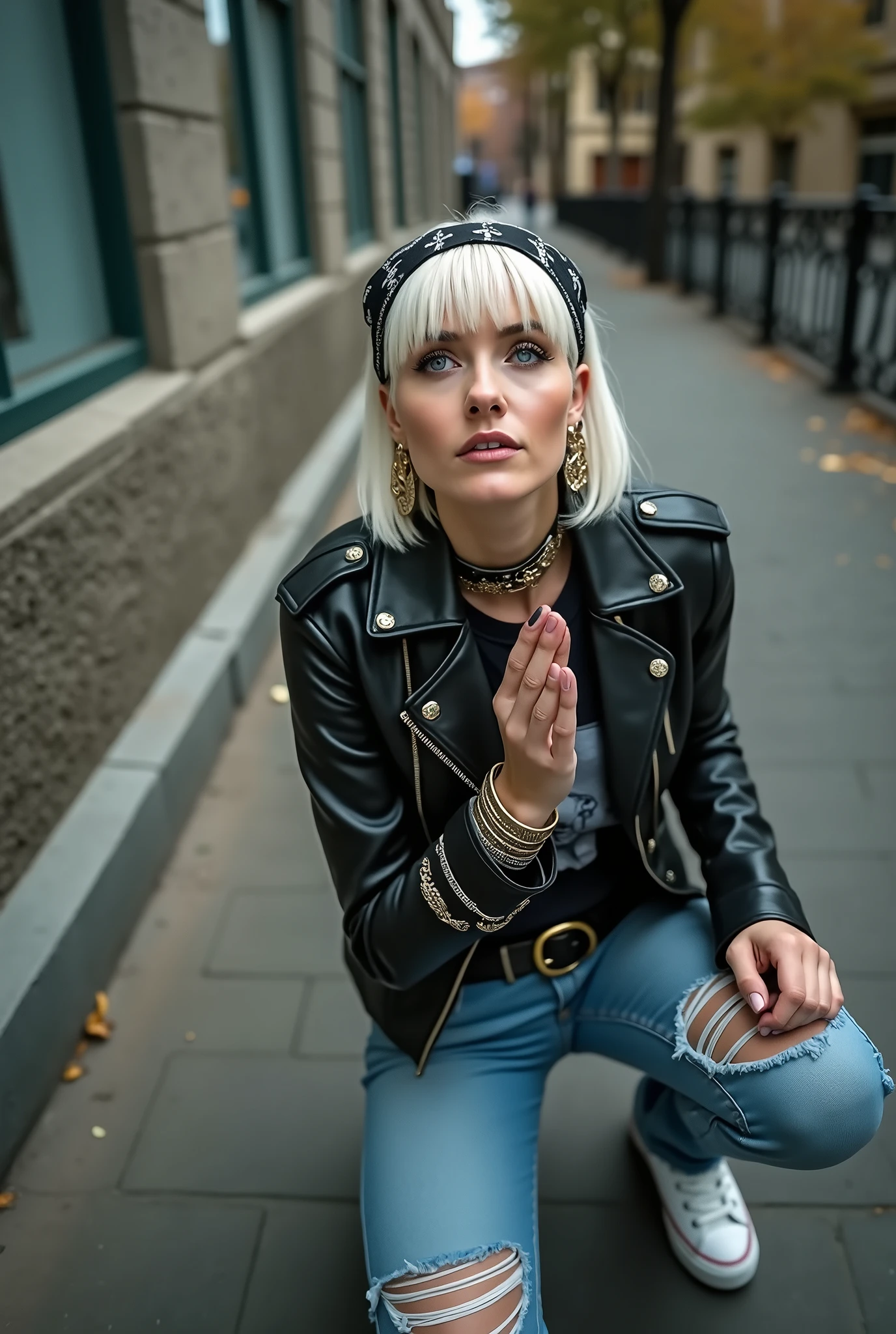 russian milf woman, platinum blonde hair (straight, middle part) with black parsley bandana headband, with very light blue eyes, extremely pale. Wearing black moto jacket, cropped metal band t-shirt, skinny blue jeans and wiite tennis sneakers . Lots of metallic braceles and collars. Tacky leather belt with oversized buckle. Wide loop earrings. Kneeling in a payer, chin up, mouth open in amazement
