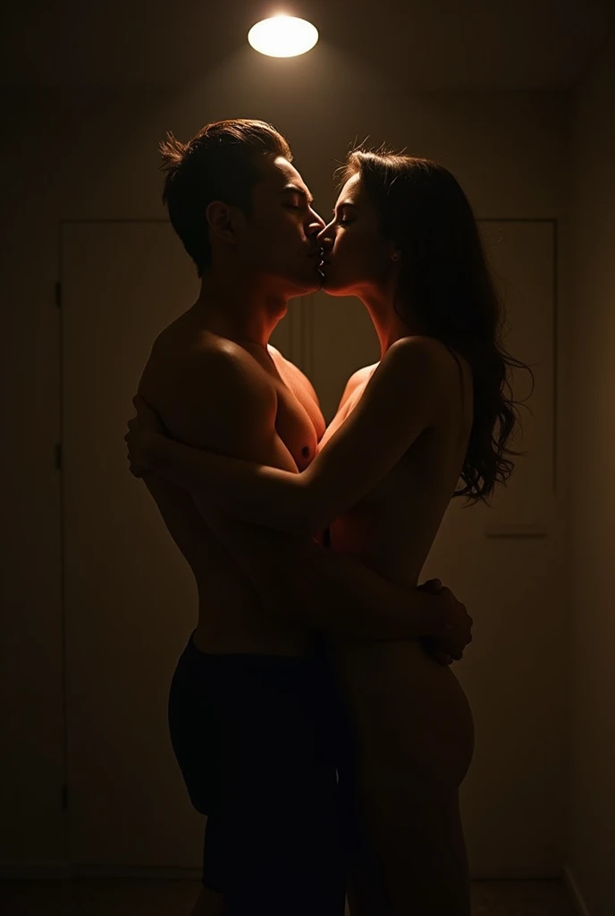 A naked man and woman, intimacy. Lit only by a light