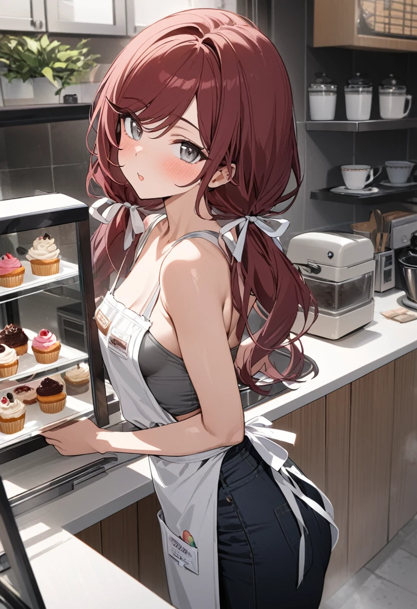 Masterpiece, highres, high Quality, detailed face, over-the-shoulder shot, solo, working behind counter, Gray eyes, dark red hair, swept bangs, low twin tails, white ribbons, gray strapless shirt with white trim, apron, nametag, black jeans, small breasts, toned arms, frosting cupcakes and donuts behind glass, kitchen, cafe, potted flowers,