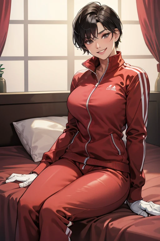 A muscular mature woman with short black hair, wearing a red long-sleeved tracksuit and large pink rubber gloves, is sitting on a bed and smiling.