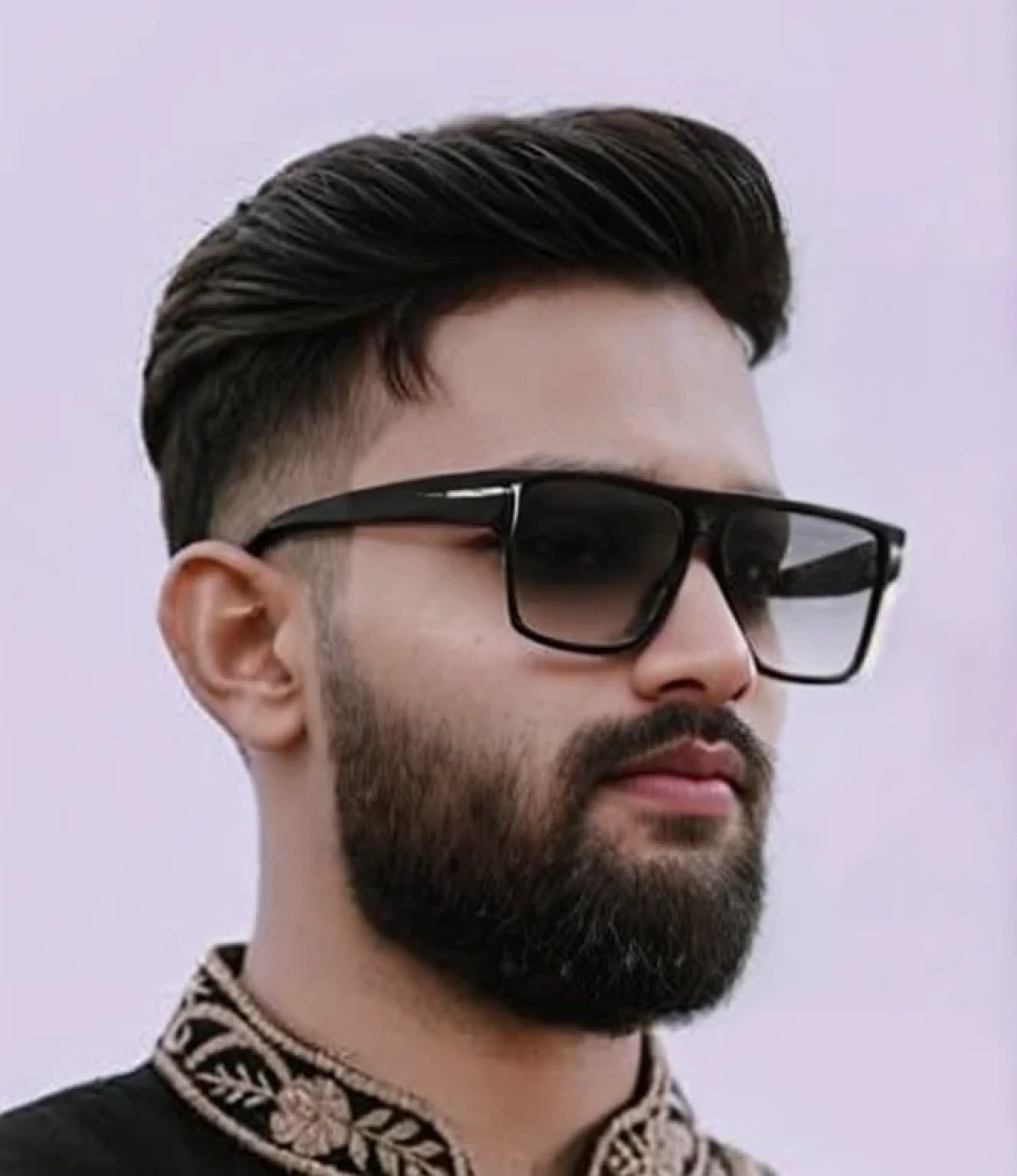 A beautiful young bearded man with highly detailed skin.black hair.happy emotion